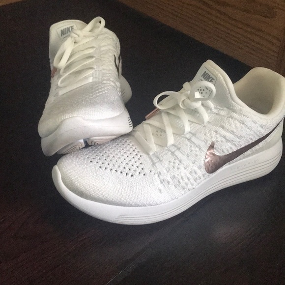 white nike with rose gold swoosh